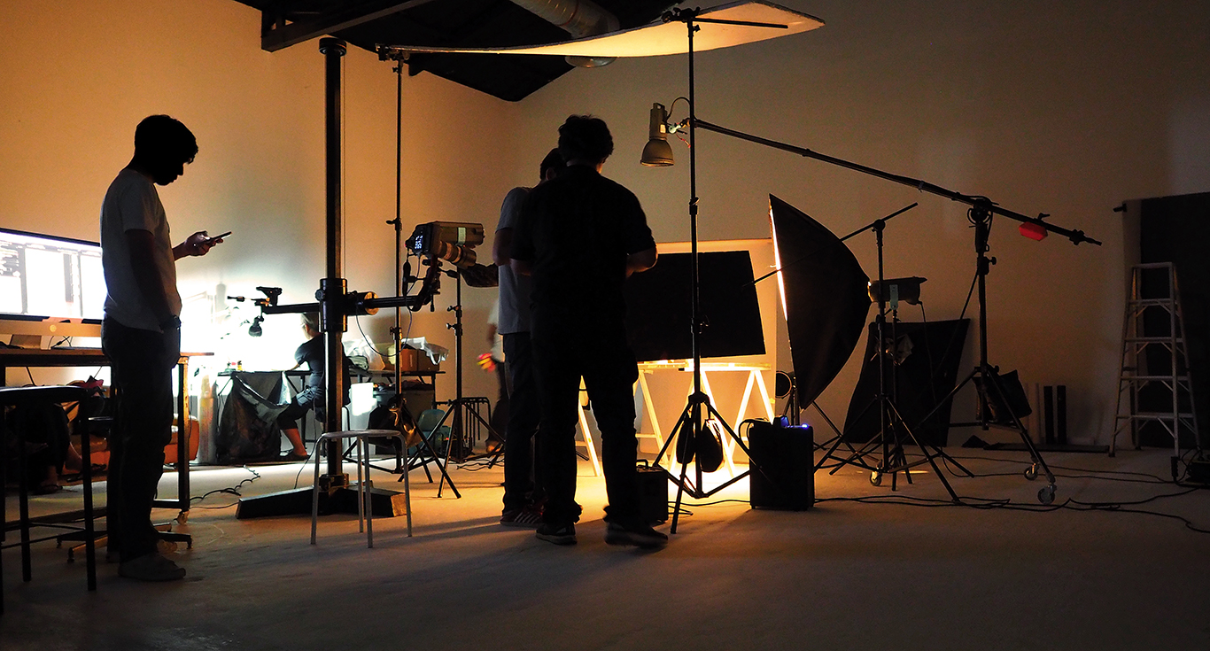 Production team shooting some video movie for tv commercial with studio equipment set.